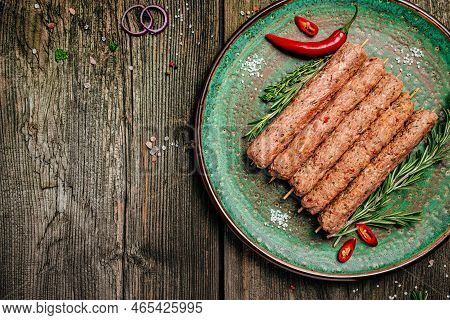 Raw Lula Kebab On Skewers With Spices. Lula Kebab, Traditional Caucasian Dish. Long Banner Format. T