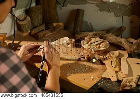 Female Using Power Working Tools Graver For Wooden Utensils Spoon
