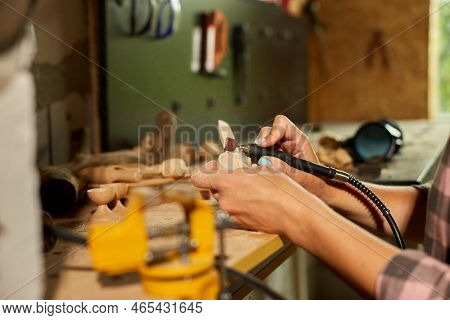 Female Using Power Working Tools Graver For Wooden Utensils Spoon