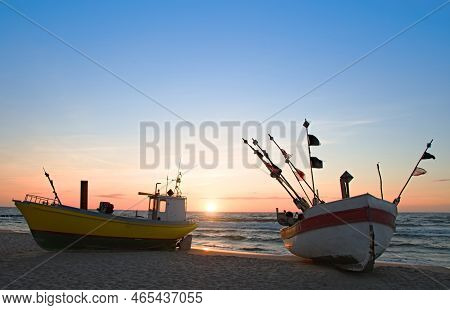 Fishing Boat On The Beach Of The Polish Baltic Coast Near Rewal. Sunset