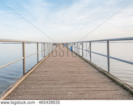 Wooden Terrace Mole Or Pier In Dranske. Wooden Dock Pier.  Baltic Sea Beach In Germany. Beach In Dra