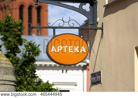 Torun, Poland - August 11, 2022: Apteka Logo (pharmacy In English) At Drugstore Storefront In Poland