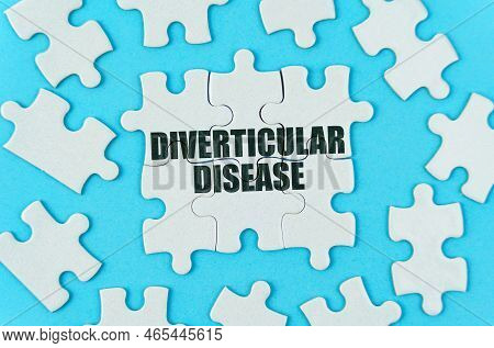 Medical Concept. On A Blue Background Are White Puzzles With The Inscription - Diverticular Disease