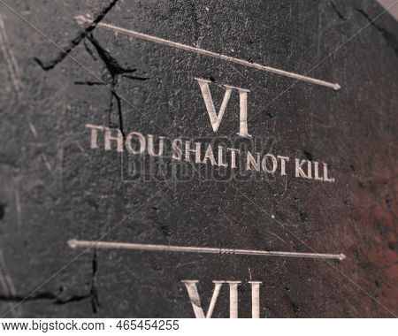 A View Of The Sixth Commandment Etched Into A Cracked Stone Tablet On An Isolated Background - 3d Re