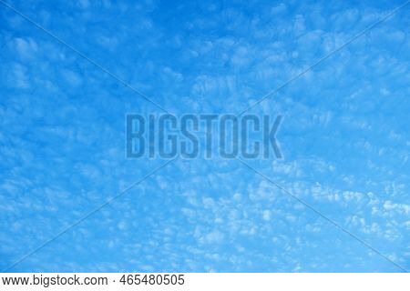 Clouds In The Blue Sky. Natural Sky Background Texture, Beautiful Color. Peaceful Blue Sky With Ligh