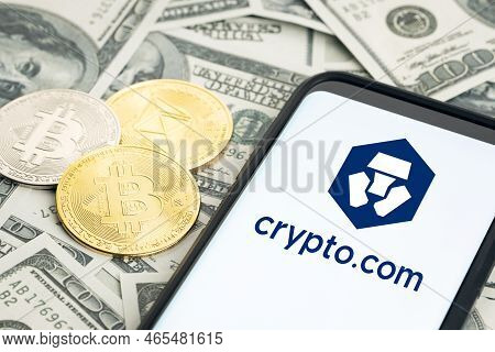 Galicia, Spain; January 28, 2022: Smartphone Screen Showing Crypto.com Logo And Dollar Banknotes And