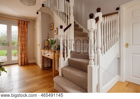 Fen Ditton, England - Jan 10 2019: Luxury House Entrance Hall With Carpetted Stairs Leading To First