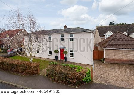Fen Ditton, England - Jan 10 2019: Elevated View Of Substantial Detached Rendered House With Numerou