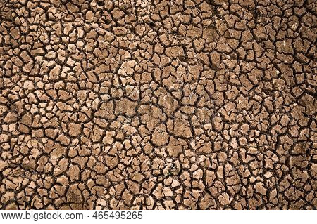 Droughty Earth With Deep Cracks, The Soil After The Water Draining. Concept Of Ecology Issues, Globa