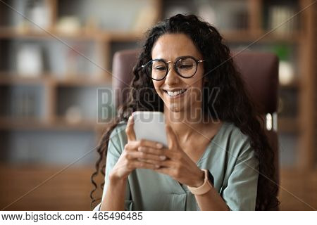 Happy Attractive Woman Wearing Eyeglasses Using Cell Phone