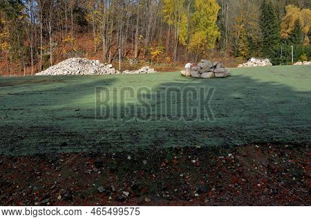 Trading In River Boulders For Decorative And Building Purposes. A Brewer On A Pile Of Round And Roun