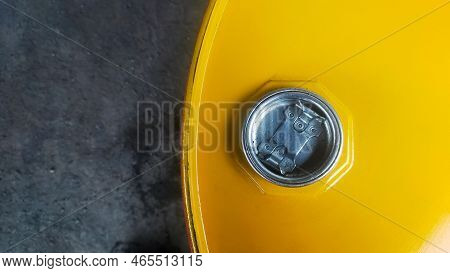 Top View Of Oil Drum Cover With A Little Oil Spill On The Ground.