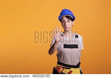 Young Handywoman Disapproving Rejecting Idea, Raising Palm To Show Refusal And Decline Suggestion. S