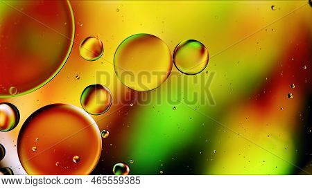 Abstract Colorful Food Oil Drops Bubbles And Spheres Flowing On Water Surface