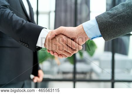 Business Man Shaking Hands With His Business Partner.