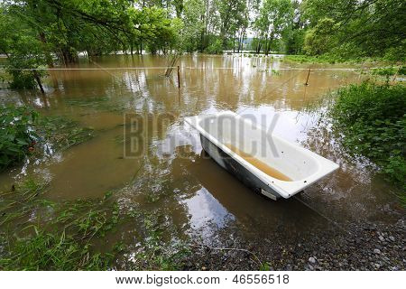Flooded landscape with lost bathtub. Radbuza river, Pilsen city, Czech republic, Europe.
