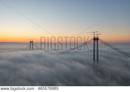 Panoramic Aerial Drone View From Above Of The Suspended Bridge Over Danube River, Under Construction