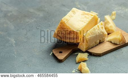 Gruyere Hard Yellow Cheese. A Traditional Swiss Hard Yellow Cheese Without Holes, With A Dark Crust 