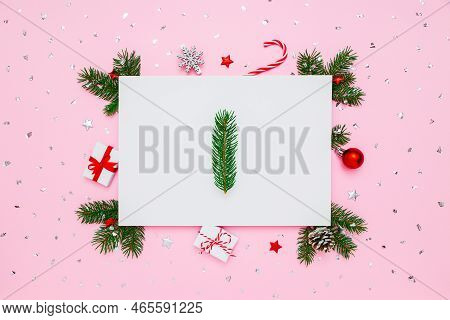 Christmas, New Year Holiday Layout. Natural Fir Tree Branche In Frame Of Decorations On White And Pa