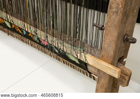 Carpet Weaving, Traditional Hand Loom Or Handloom On White Background. Close-up, Selective Focus.