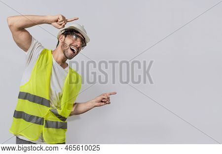 Builder Engineer Pointing Finger To The Right Isolated, Construction Engineer With Vest Pointing At