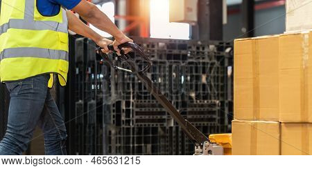 Working At Warehouse. Male Warehouse Worker Checking In Storage Department. Employee Organizing Good
