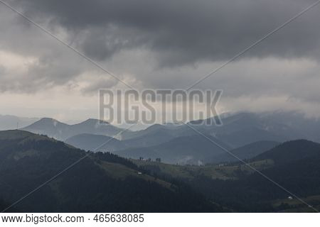 Dark Forest Mountain Range In A Misty Gray Deep Fog In The Carpathians Mountains, Chornogora, Ukrain