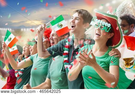 Mexico Football Supporter On Stadium. Mexican Fans On Soccer Pitch Watching Team Play. Group Of Supp