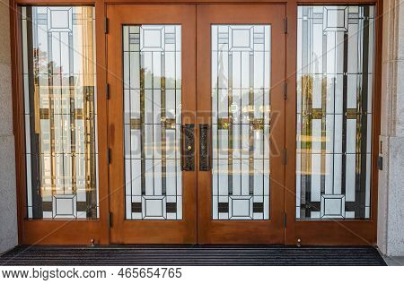 Stain Glass Door. Front Entrance Of A Traditional House With Mission Style Stained Wood Door. Glass 