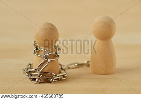 Wooden Pawn With Chains Controlled By His Partner - Concept Of Toxic Relationship, Love, Domination 