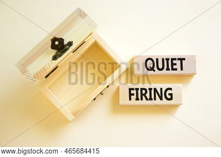 Quiet Firing Symbol. Concept Words Quiet Firing On Wooden Blocks. Beautiful White Table White Backgr