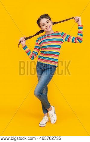 Full Length Of Teen Girl With Braided Hair In Studio. Photo Of Teen Braided Girl.