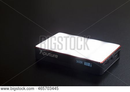 Led Aputure Mc Lit On Top Of A Black Table. Brightness Of Light. Led Concept. Lighting Concept.