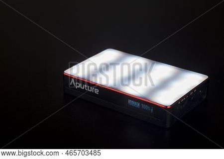 Led Aputure Mc Lit On Top Of A Black Table. Brightness Of Light. Led Concept. Lighting Concept.