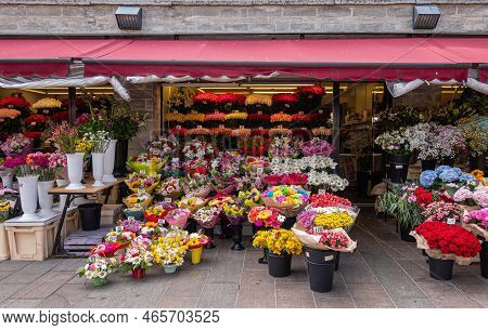 Estonia, Tallinn - July 21, 2022: Abundance Of Colors On Flower Market Along Viru Streeet. Covered B