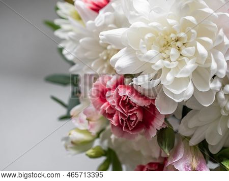 Bouquet Close-up. Bouquet Of White Chrysanthemums, Red Carnations And Eucalyptus Leaves. On The Wind