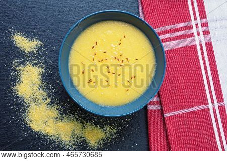 Cornmeal Porridge With Different Seeds In  Bowl . Flat Lay