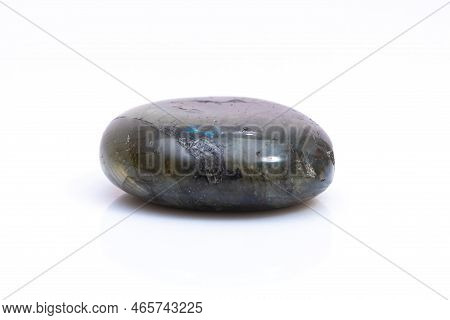 Natural Gemstone Labradorite Isolated On White Background. Dark Gray Labradorite With An Inner Iride