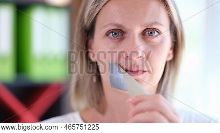 Woman Removes Adhesive Tape Covering Her Mouth. Concept Of Freedom Of Speech, Human Rights And Democ