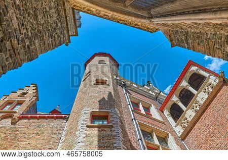 Bruges, Belgium - July 20, 2020 The  Upward View Of The Cruuthusemuseum Palace In The Courtyard Of T