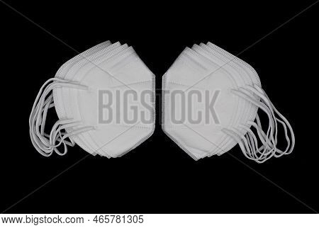 Disposable Kn-95 Masks Or White Colored New Medical Masks. Covid-19 Prevention. H1n1, H5n1 Safety Me