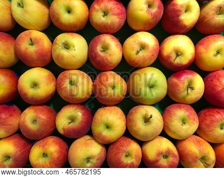 Cox Apples Arranged In Stack In Supermarket For Sale. Background Image Of Apple Fruits.