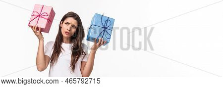 Celebration, Holidays And Presents Concept. Hmmm Interesting What Inside. Portrait Of Curious Young 