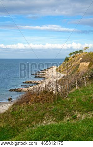 Hundested, Denmark On The Cliff Overlooking The Sea. Baltic Sea Coast, Grassy Meadow, Beach. Clouds 