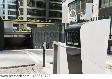 Parking Meters On City Street Near Buildings