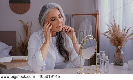 Caucasian 60s Aged Senior Mature Lady Old Gray-haired 50s Woman Female Looking At Mirror Reflection 