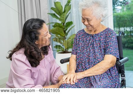 Caregiver Help And Care Asian Senior Or Elderly Old Lady Woman Patient Sitting On Wheelchair At Home