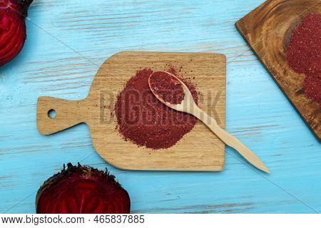 Beetroot Powder, Wooden Background, Vulgar Conditiva Contains A Very Intense Red Dye. Top View. Flat