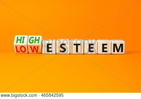 High Or Low Esteem Symbol. Concept Words High Esteem And Low Esteem On Wooden Cubes. Beautiful Orang