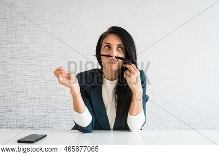 Young Caucasian Brunette Business Woman Director In Office Play Hair Make Fish Face. Bored Business 